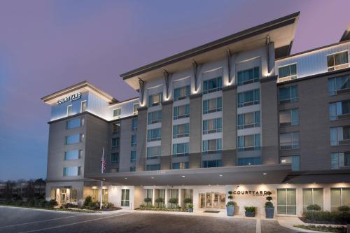a rendering of the front of a hotel at Courtyard by Marriott Atlanta Alpharetta/Avalon Area in Alpharetta