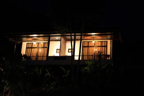a house at night with the lights on at Chang Pai Hill in Pai