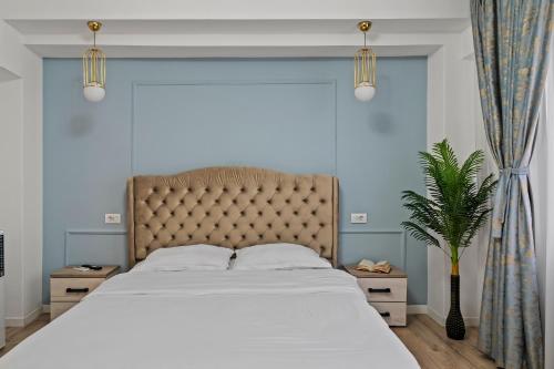 a bedroom with a large bed with a large window at Garsoniera LUX Piata Natiunile Unite in Bucharest