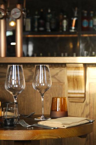 two wine glasses sitting on top of a table at Coach & Horses Dersingham in Dersingham