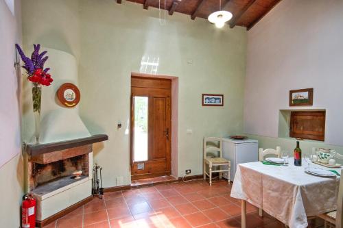 a living room with a table and a fireplace at Borgo Romena in Pratovecchio