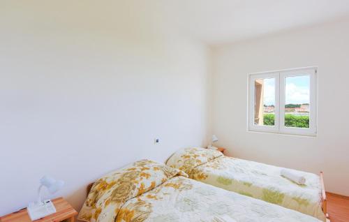 Katil atau katil-katil dalam bilik di 2 Bedroom Awesome Apartment In Ugljan