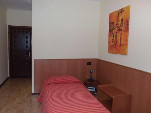 Postel nebo postele na pokoji v ubytování Hotel Vezzano