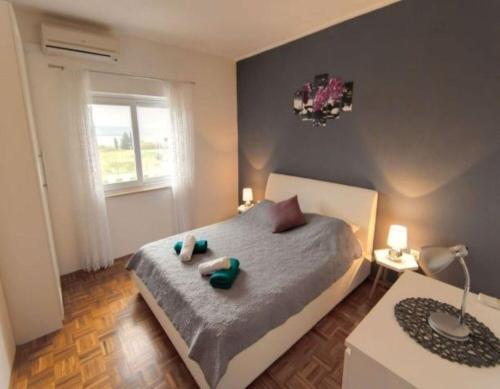 Posteľ alebo postele v izbe v ubytovaní Apartments Miljenko