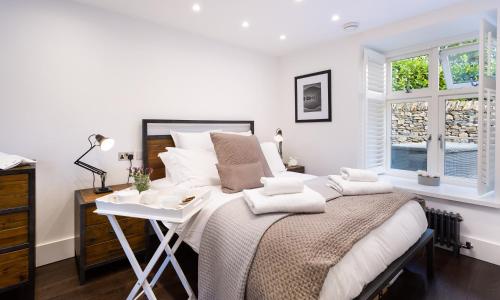 Кровать или кровати в номере River Barn