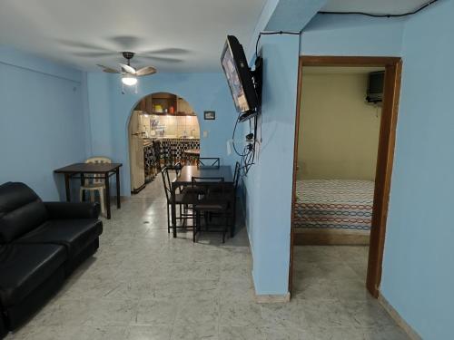 a living room with a couch and a table at Apartamento alquiler cuidad flamingo in El Marite