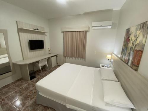 Ideal Praia Hotelにあるベッド