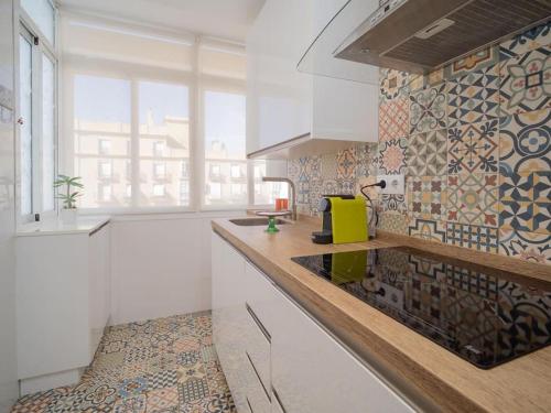 a kitchen with a counter with a yellow appliance on it at SibsSanlucar Calma - Centro y Playa - Nuevo in Sanlúcar de Barrameda