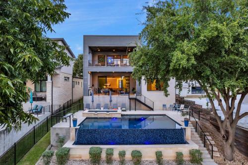 an exterior view of a house with a swimming pool at Lakeshore Retreat with Concierge Services in Kingsland