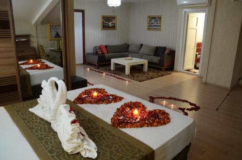 a living room with a table with candles on it at Gumus Palace Hotel in Istanbul