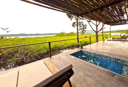 a swimming pool on the deck of a villa at La Purita Ecolodge in The Gap