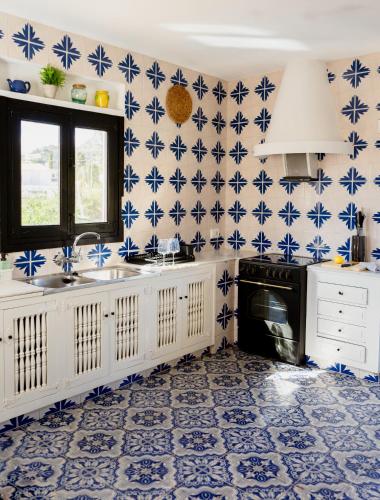 a kitchen with blue and white tiles on the wall at La Renda Mediterranean Villa - Beach, Jávea Port and amenities within walking distance in Jávea