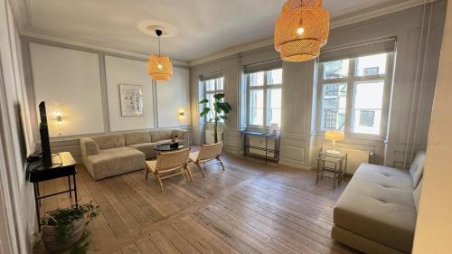 a living room with a couch and a table at The Admiral in Copenhagen