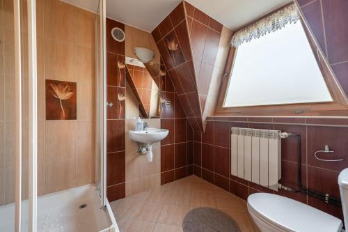 Kúpeľňa v ubytovaní Domek Pod Strzechą