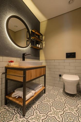 a bathroom with a sink and a toilet at TSL Serviced Apartments Kağıthane in Istanbul