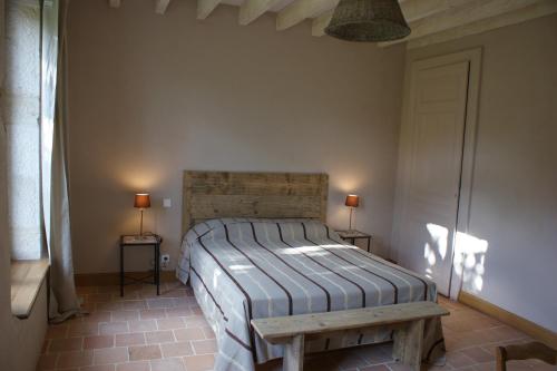 Säng eller sängar i ett rum på Gîte La Maison De Lucien