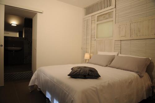 a bedroom with a bed with a pillow on it at Iblainsuite in Ragusa