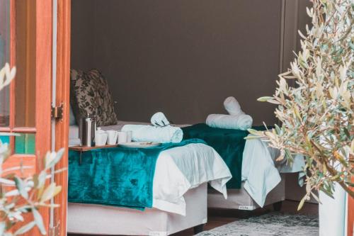 Ένα ή περισσότερα κρεβάτια σε δωμάτιο στο Olive Tree Lodge