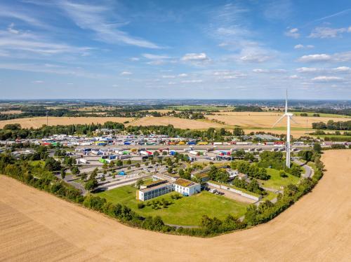 an aerial view of a wind farm with a windmill at Dresdner Tor Süd in Wilsdruff