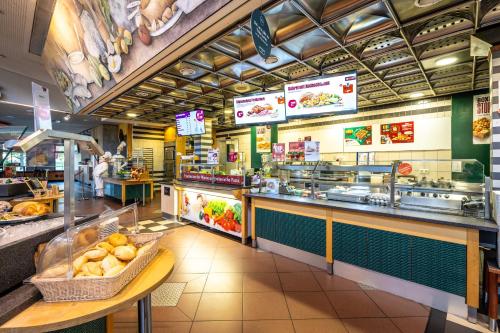 a fast food restaurant with a counter with food at Dresdner Tor Süd in Wilsdruff