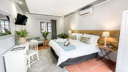 Μια τηλεόραση ή/και κέντρο ψυχαγωγίας στο Olive Tree Lodge