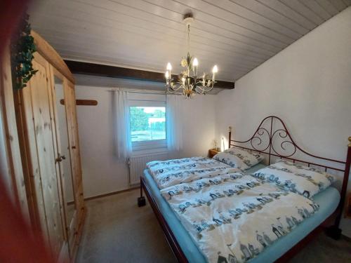 Postel nebo postele na pokoji v ubytování Ferienhaus MEERZeit