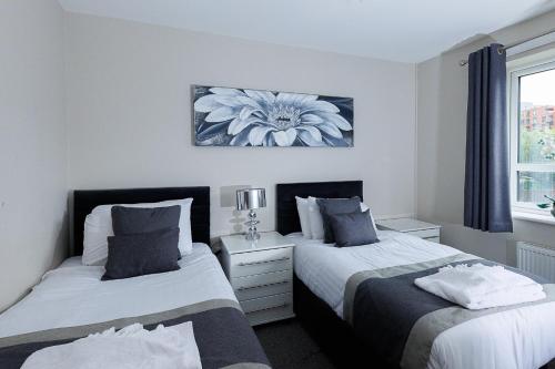 Ένα ή περισσότερα κρεβάτια σε δωμάτιο στο Riverside Villas