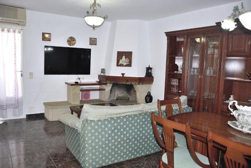 a living room with a couch and a fireplace at Can Teixidó in Arbeca
