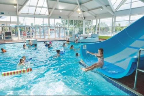a group of people in a swimming pool at Haven Caravan Park Cala Gran in Fleetwood