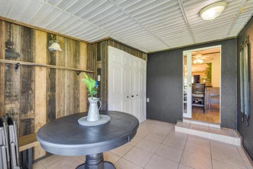 a table with a vase on it in a room at Pet-Friendly Ocala Vacation Rental with Patio! in Ocala
