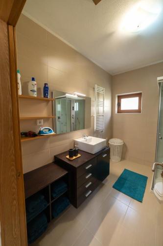 a bathroom with a sink and a mirror at Casa do Casal do Douro in Marco de Canaveses