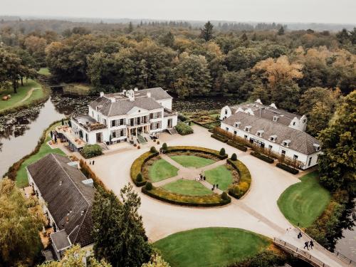 an aerial view of a mansion with a large yard at Kasteel Engelenburg in Brummen