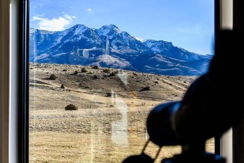 a view of a mountain from a train window at Double MM Ranch in Emigrant