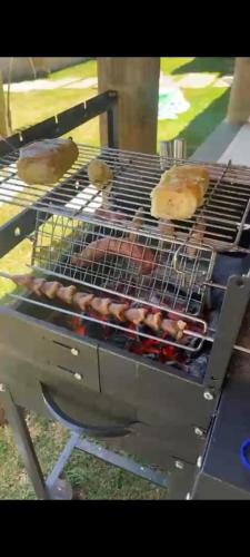 a grill with donuts and donuts on it at Casa das Pedras in Lagoa Santa