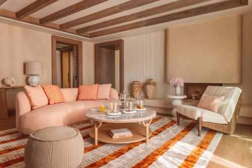 a living room with a couch and a table at Royal Mansour Tamuda Bay in M'diq
