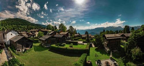 an aerial view of a village in the mountains at Victoria Retreat & Spa in Vercorin