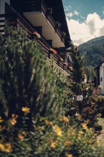 a building with some plants in front of it at Victoria Retreat & Spa in Vercorin
