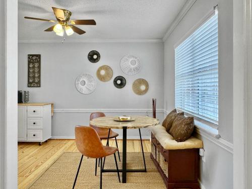 a living room with a table and a couch at Cozy Home Away From Home - Pet-friendly, King bed in Charleston