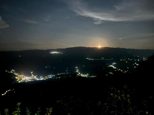 a view of a city lit up at night at Holiday Rome Hub Brigands' Fortress in Rocca Canterano in Canterano