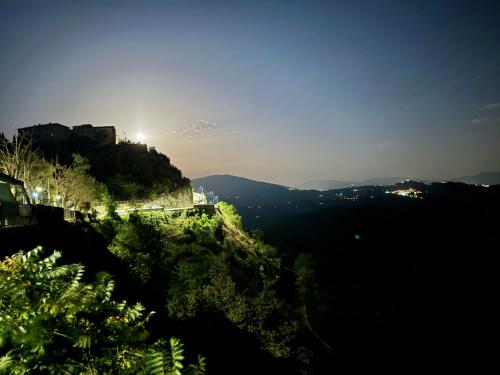a view of a mountain with the sun shining on it at Holiday Rome Hub Brigands' Fortress in Rocca Canterano in Canterano