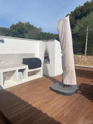 a chair on the roof of a house at Beach House Mallorca in Cala Pi