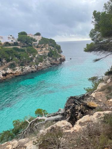 a view of the ocean from a cliff at Beach House Mallorca in Cala Pi