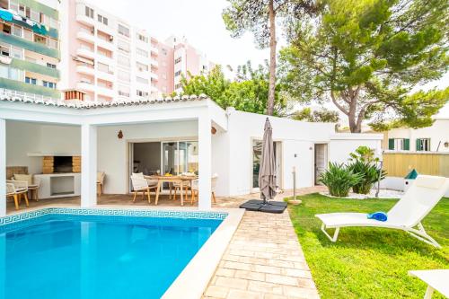 an image of a villa with a swimming pool at Urban Bliss Guesthouse II in Faro