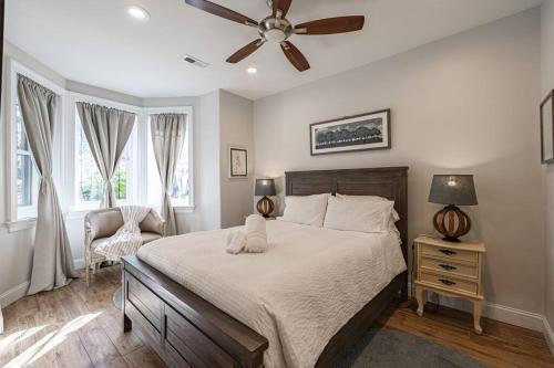 a bedroom with a bed and a ceiling fan at Central LUX Apartment in DC in Washington, D.C.