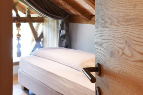a close up of a bed in a room at Grieserhof Nals in Nalles