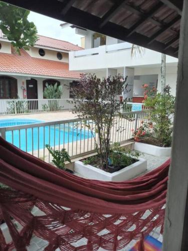 Πισίνα στο ή κοντά στο Apartamento com piscina condomínio Tapitema