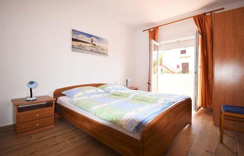 Ένα ή περισσότερα κρεβάτια σε δωμάτιο στο Apartments Loris