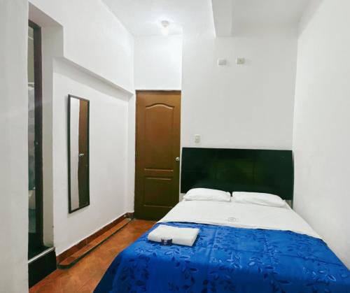 Postel nebo postele na pokoji v ubytování Hostal Wan Ka Trujillo