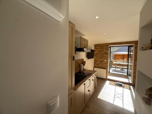 a kitchen with a sink and a counter at La Foux D'Allos Rez de jardin plein sud 50m des remontées mécaniques in La Foux