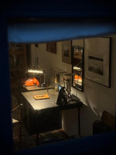 a view of a room with a table and a mirror at ShuShu Homestay in Jiufen